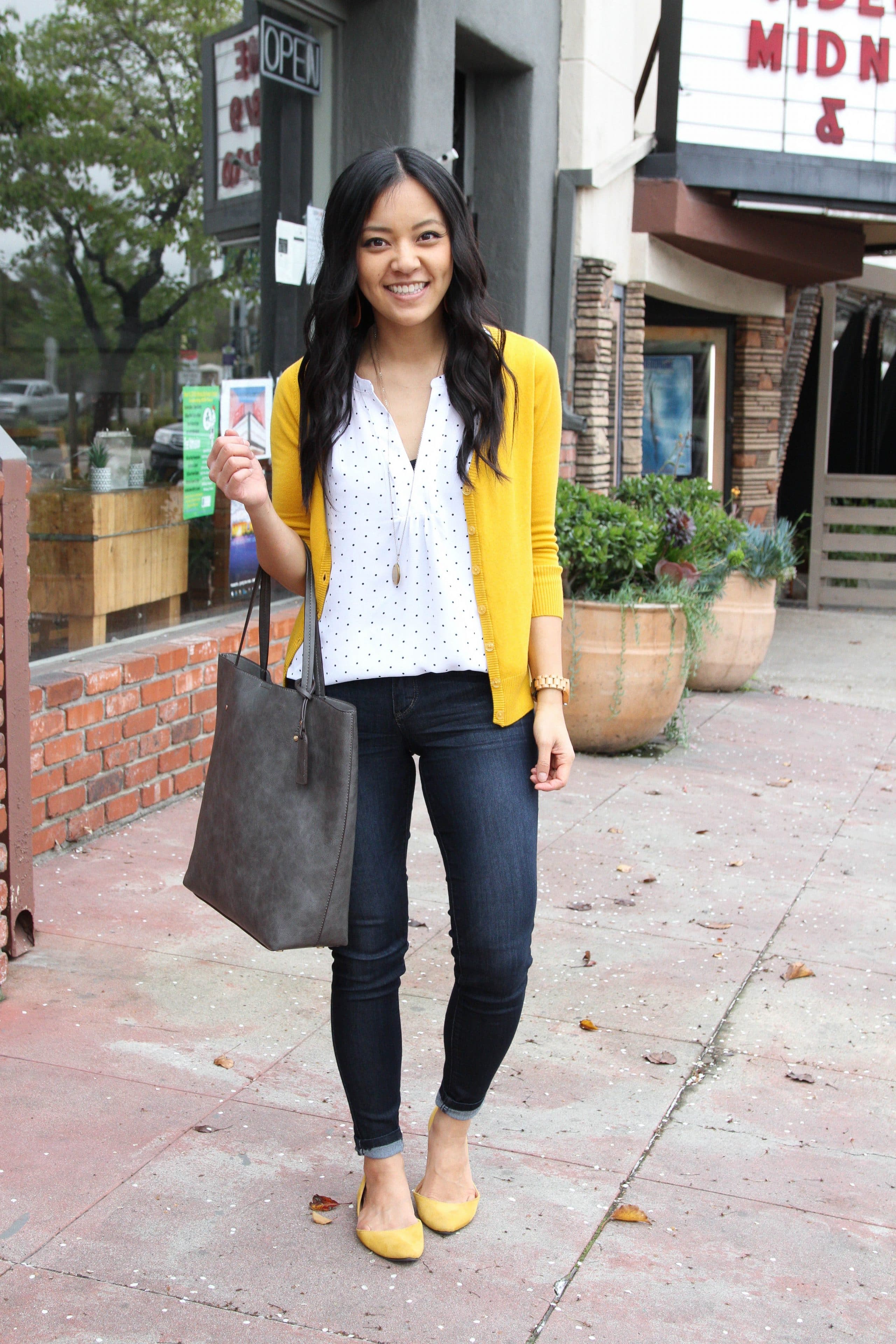 white patterned top, yellow cardigan 