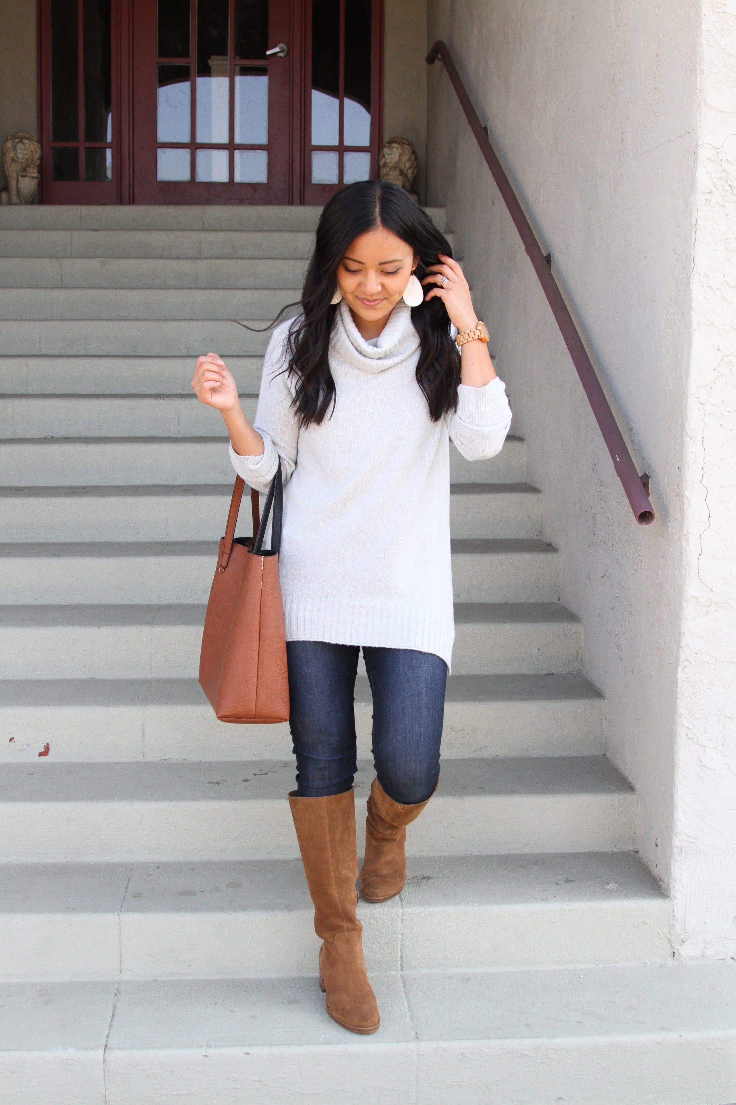 grey sweater with tan boots